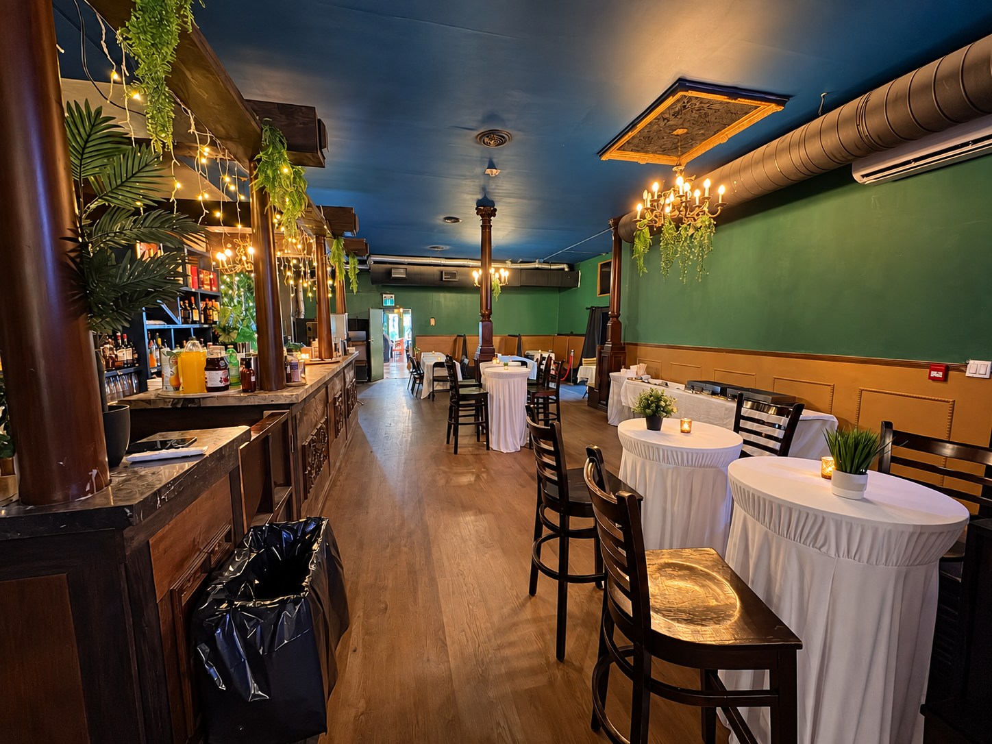Moonlight Lounge bar on the left and dining tables on the right toward the entrance