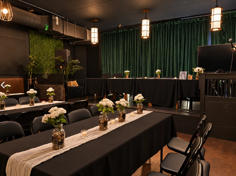 Wedding banquet setup in Moonlight Lounge with white flowers and warm lighting